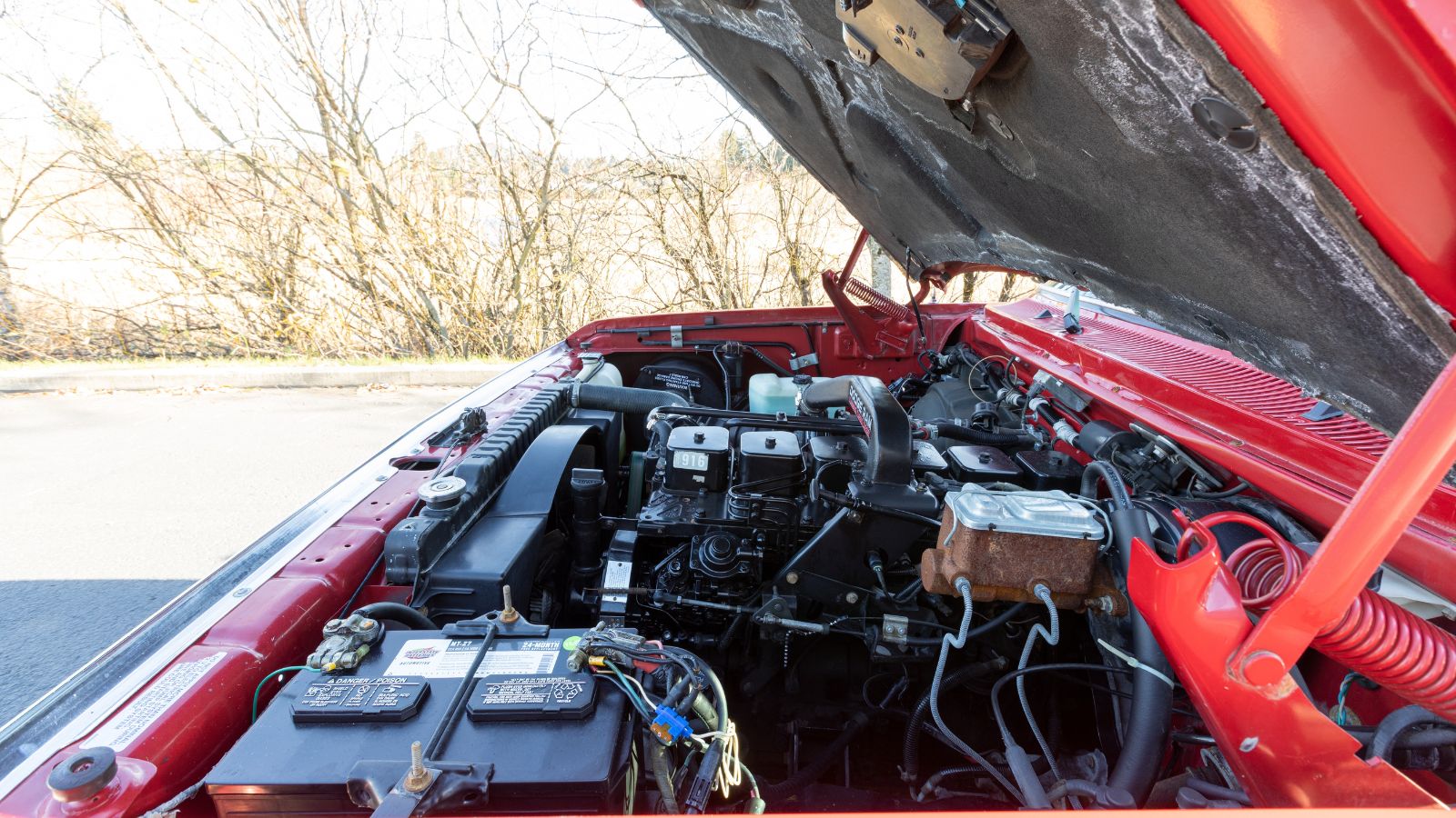 1989 Red Dodge Ram 250 Cummins Turbo Diesel 4x4 off-road American classic regular cab pickup truck SUV under hood turbo diesel engine, vintage heavy-duty