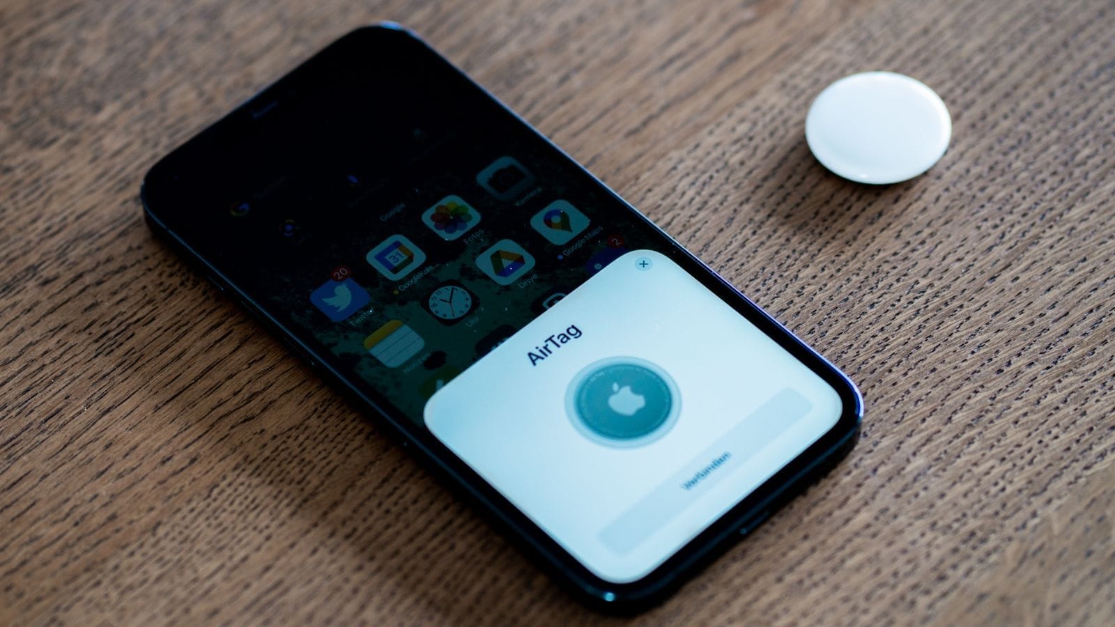 An Apple AirTag being set up using an iPhone 12 Pro Max