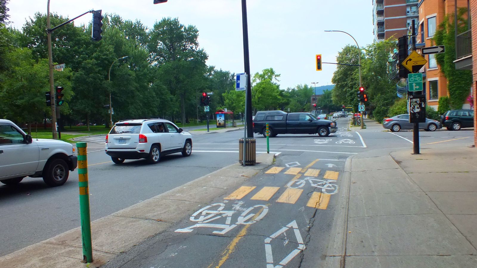 Montreal, CA-July 2013, Bike lane signs on a city bicycle lane in Montreal, Quebec, Canada.