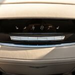 Black Cadillac Escalade , car Interior - Buttons for turning on the car air conditioner on the climate control panel for rear seats