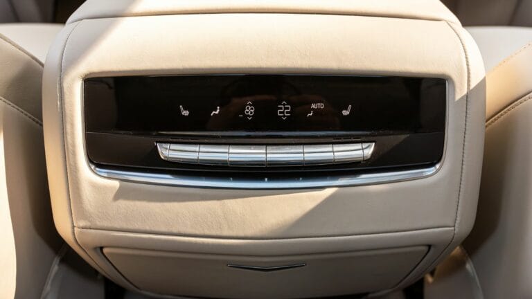 Black Cadillac Escalade , car Interior - Buttons for turning on the car air conditioner on the climate control panel for rear seats