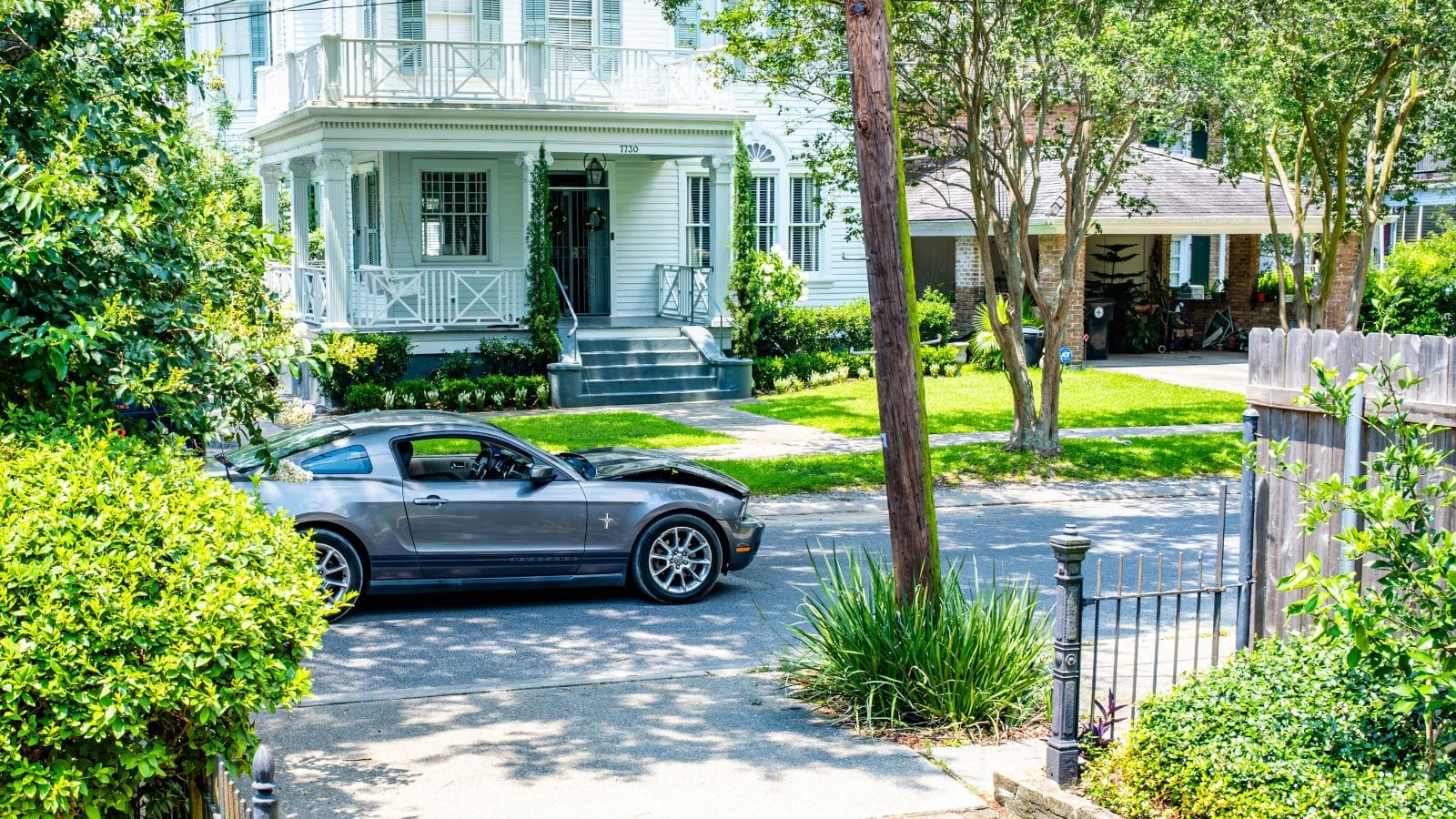 Damaged and abandoned Mustang left in the middle of the street