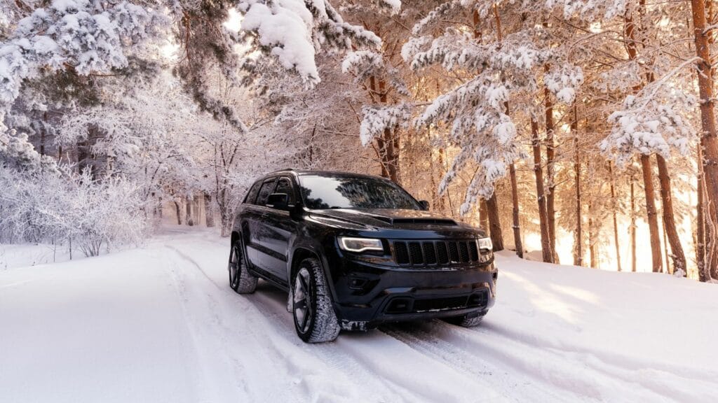 Jeep grand cherokee wk2 Trackhawk. The car is in the forest in winter. snowy forest