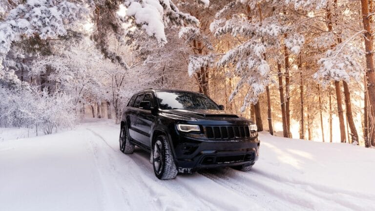 Jeep grand cherokee wk2 Trackhawk. The car is in the forest in winter. snowy forest