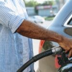 Man filling gasoline fuel