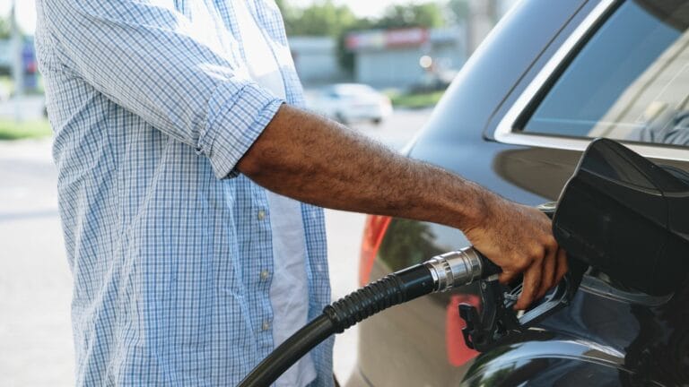 Man filling gasoline fuel