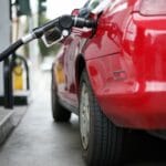 Red car at gas station