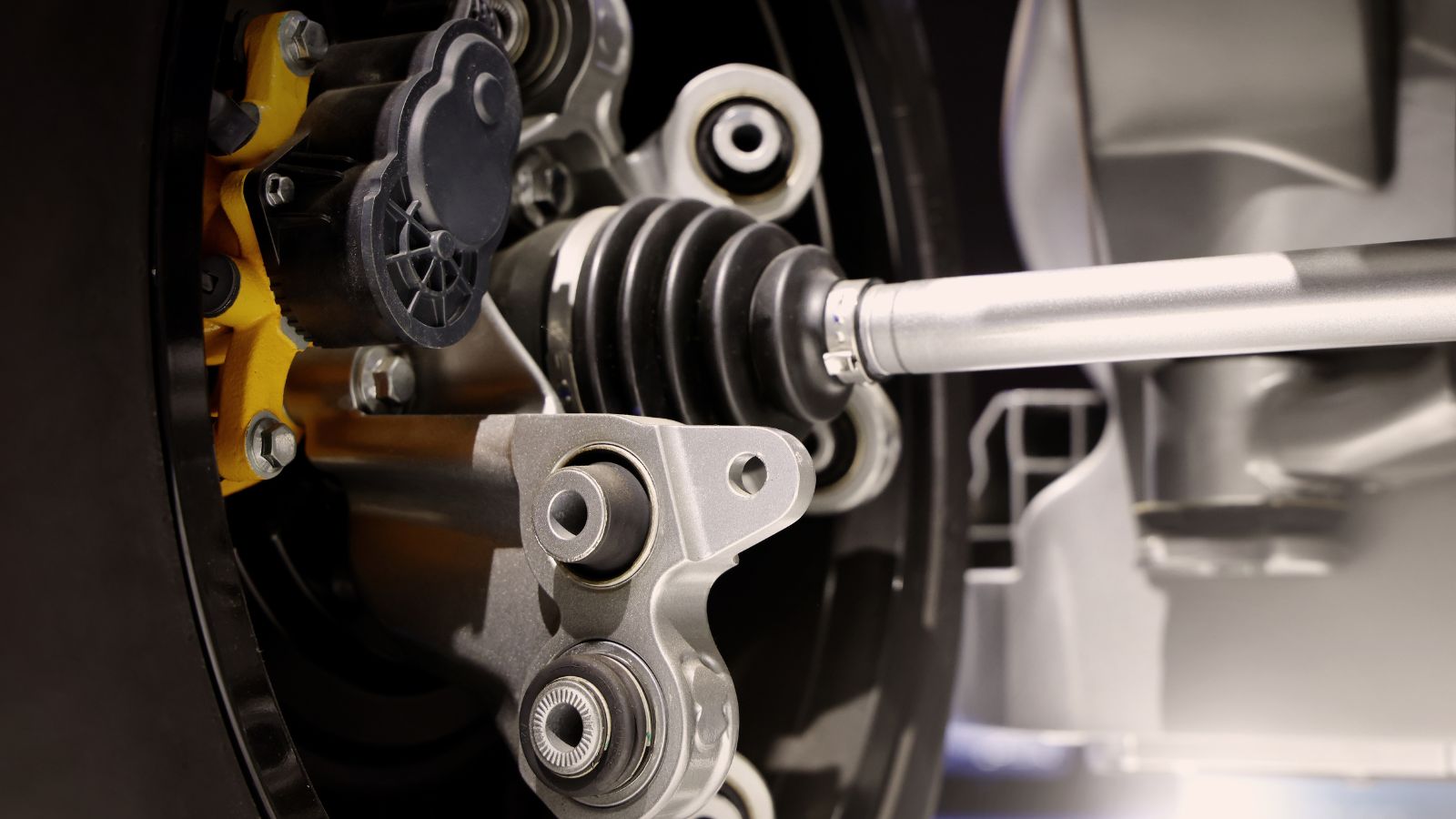 Car suspensions. Close up of a car suspension parts system such as CV joint Rubber boot and Control arms bushing Steering rack axles Shock absorber suspension Brake. Repair and spare parts for cars.