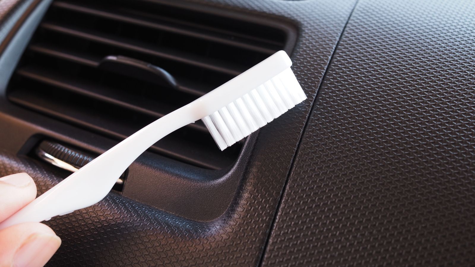 Using toothbrush to cleaning and remove dust