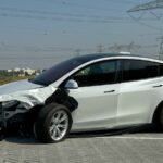 a damaged Tesla, EV accident
