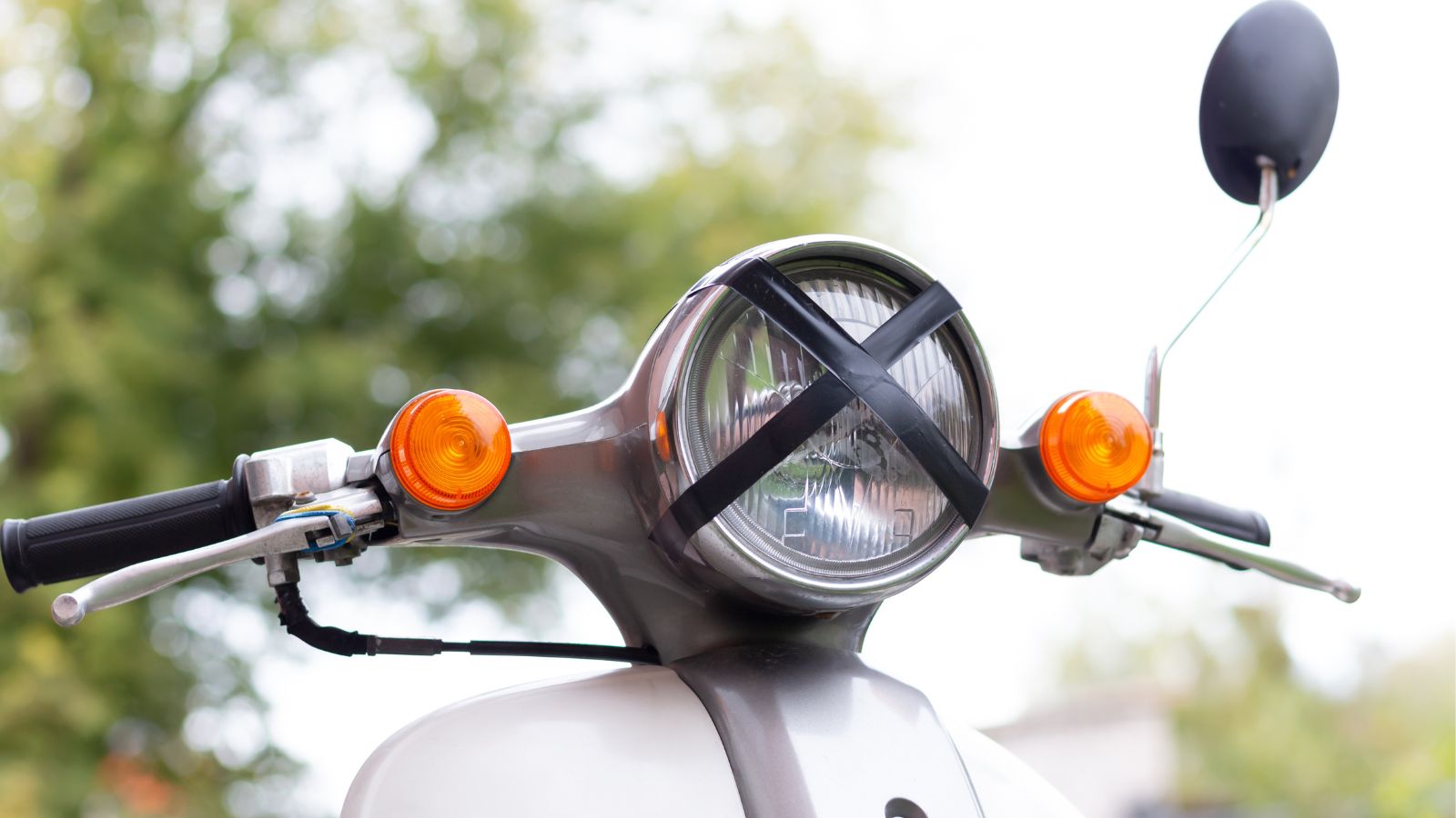 black tape cross over headlamp