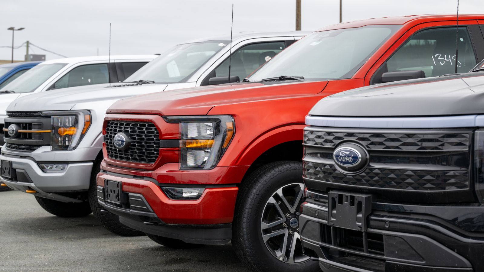 new vehicles are parked on a dealership