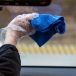 Cleaning car's windshield with microfiber