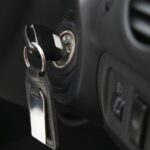 Key inserted into the lock of ignition of the car
