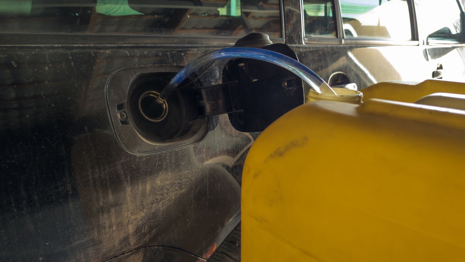 Large yellow container pours fuel