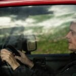 Older man drive car