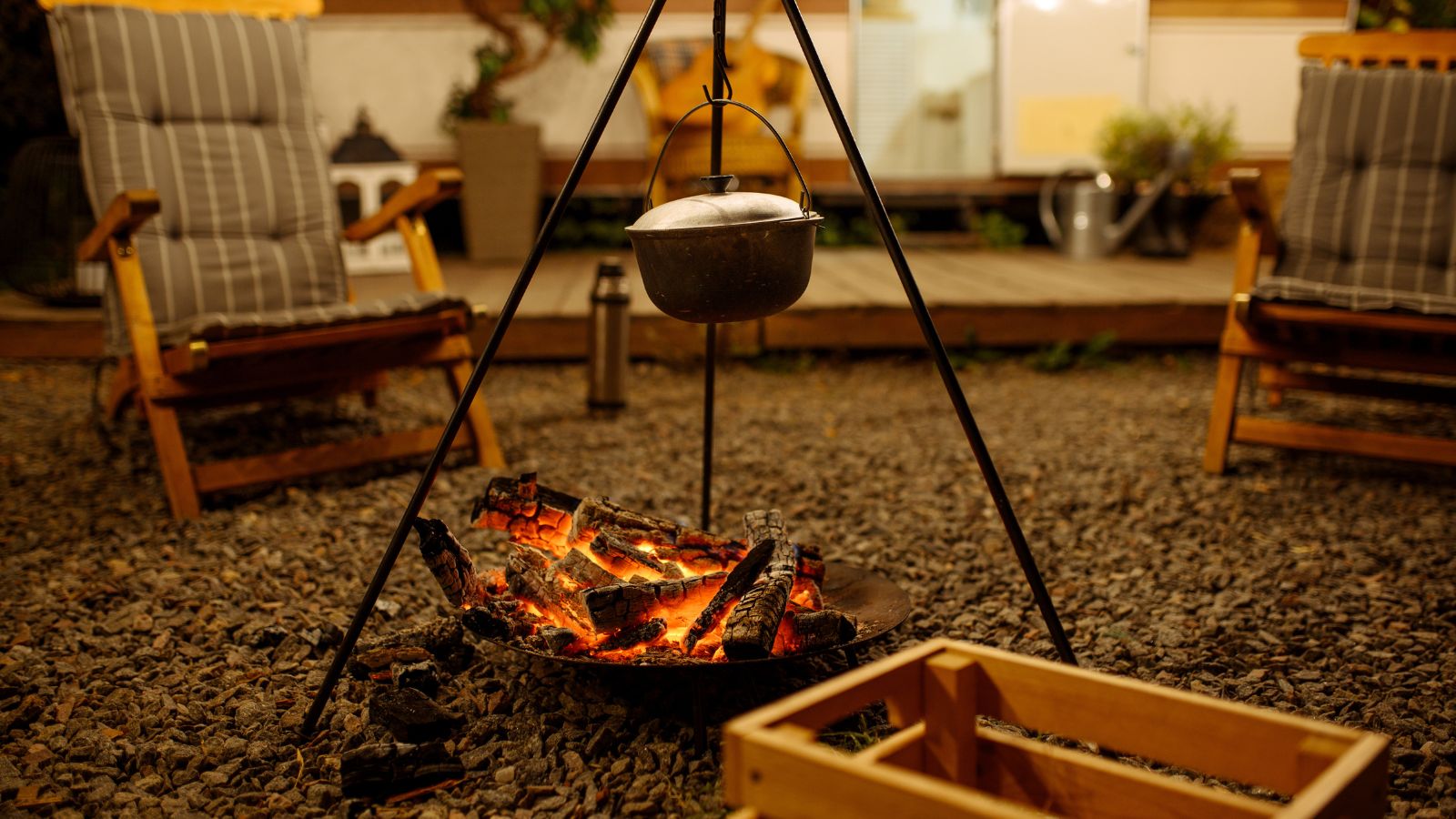 Pot is over campfire, picnic at camping