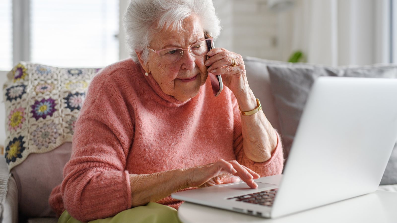 Senior woman working with laptop, shopping online