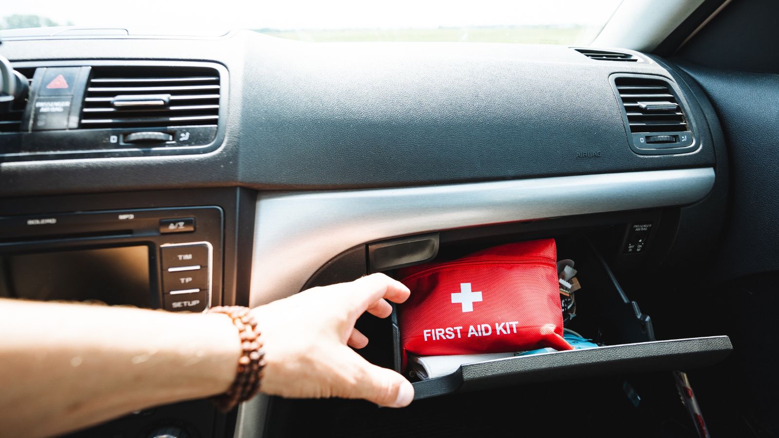 first aid kit in a car glove box