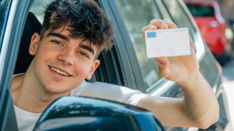 young nobel in the car with driver's license