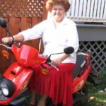 Grandmother on Yamaha BWS 50 Scooter