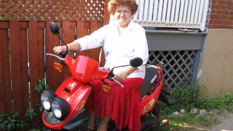 Grandmother on Yamaha BWS 50 Scooter